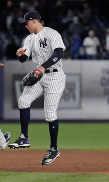 Judge homers, Robertson escapes jam to lift Yanks over Jays